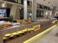 a restaurant with a buffet of food on display at WAVEVIEW 5th Floor Dream View in Międzyzdroje