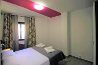 Cama o camas de una habitación en CASATURIS NEWON APARTAMENTOS en EL CAMPELLO