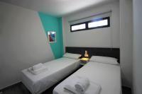 Cama o camas de una habitación en CASATURIS NEWON APARTAMENTOS en EL CAMPELLO