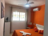 A television and/or entertainment centre at Magnificent Apartment Mar de Cristal, Pl Baja, Urb private, leisure and swim n01