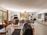 a living room with a couch and a table at Holiday Home Chez Béatrice et Pascal by Interhome in Belgodère