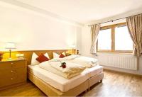 Posteľ alebo postele v izbe v ubytovaní Alpen Lodge