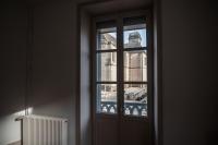 a window with a view of a building at L&#39;appartement du Cellier in Pommard