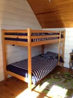two bunk beds in a room with a attic at Kerletty, la mer, les embruns, à 250 m des plages in Plouguerneau