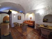 Posezení v ubytování Casas Cueva y Cortijo La Tala en Guadix