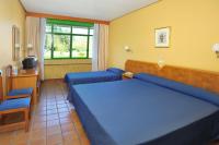 Łóżko lub łóżka w pokoju w obiekcie AS Hoteles Altube