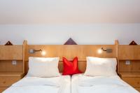 Łóżko lub łóżka w pokoju w obiekcie Hölzl Bed & Breakfast