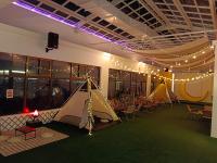a room with several tents and tables and lights at Tsun Huang Hotel in Chiayi City