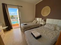 Postel nebo postele na pokoji v ubytování Casita Calma Fuerteventura