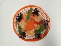 a plate of food with shrimp and tomato sauce at Cortona Resort-Le Terre Dei Cavalieri in Cortona