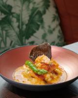 a red bowl of food with shrimp and green beans at Cromlix in Kinbuck