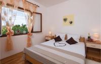 Postel nebo postele na pokoji v ubytování Three-Bedroom Holiday Home In Crkvice