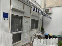 a patio with a table and a white fence at Studio-apartman Ella in Poreč