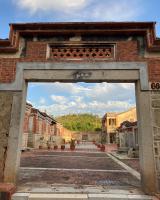 an entrance to an old building in a city at Shenten Homestay in Jincheng