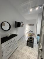 Televízia a/alebo spoločenská miestnosť v ubytovaní PebBle Apartments