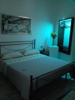 A bed or beds in a room at B&B Lo Scrigno del Salento