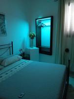 A bed or beds in a room at B&B Lo Scrigno del Salento