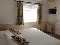 Postel nebo postele na pokoji v ubytování Byways Serviced Apartments