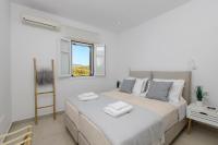 Postel nebo postele na pokoji v ubytování IL SOGNO VILLAS Paros