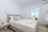 Postel nebo postele na pokoji v ubytování IL SOGNO VILLAS Paros