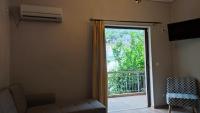 A television and/or entertainment centre at Vasileiou Apartments