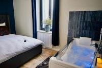 Posteľ alebo postele v izbe v ubytovaní Maison balnéo centre-ville @casaberruyere
