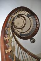 a spiral staircase with a clock on top of it at La Valette, XVIIs House, Futuroscope in Saint-Léger