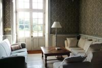 a living room with couches and a coffee table at La Valette, XVIIs House, Futuroscope in Saint-Léger