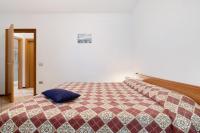A bed or beds in a room at Rustico Spagnol 3
