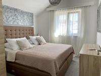 Posteľ alebo postele v izbe v ubytovaní Apartment Simply The Best
