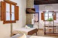 Posteľ alebo postele v izbe v ubytovaní SUITES CASA DE LAS COLUMNAS