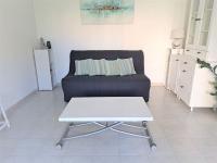 A seating area at Fr&eacute;jus, studio, 100 m de la plage-port Fr&eacute;jus