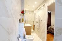 a bathroom with a toilet and a sink and a shower at Le Domaine : maison proche de la plage et du port in Fécamp