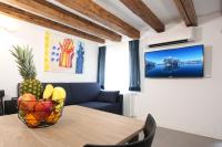 TV a/nebo společenská místnost v ubytování Residence degli Artisti