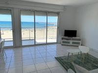 Televízia a/alebo spoločenská miestnosť v ubytovaní Bel Appartement en front de mer -Palavas les Flots