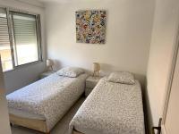Posteľ alebo postele v izbe v ubytovaní Bel Appartement en front de mer -Palavas les Flots