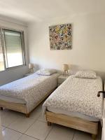 Posteľ alebo postele v izbe v ubytovaní Bel Appartement en front de mer -Palavas les Flots