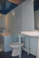 a bathroom with a toilet and a sink and a tub at La Valette, XVIIs House, Futuroscope in Saint-Léger