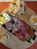 a plate of food with different types of bread and meats at La paillote idyllique in Faverolles-sur-Cher