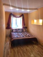 a small bedroom with a bed with a window at Квартира в центрі на Волі 8 in Lutsk