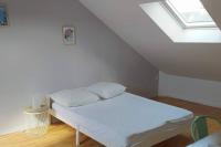 Łóżko lub łóżka w pokoju w obiekcie Maison 6 chambres avec jardin à Angers