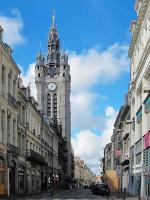 a clock tower in the middle of a city street at Le cocon du Nil jolie studio in Douai