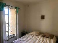 Łóżko lub łóżka w pokoju w obiekcie Appartement face aux Arènes
