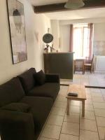 Część wypoczynkowa w obiekcie Appartement face aux Arènes