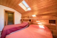 Łóżko lub łóżka w pokoju w obiekcie Apt Chénives 2 - Morzine
