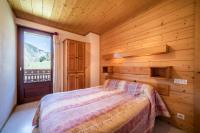 Łóżko lub łóżka w pokoju w obiekcie Apt Chénives 2 - Morzine