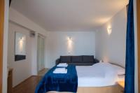 Postel nebo postele na pokoji v ubytování Apartments Kiki