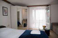 Postel nebo postele na pokoji v ubytování Apartments Kiki