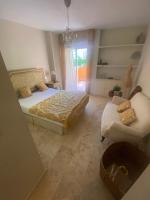 Postel nebo postele na pokoji v ubytování Apartamento guadalmina