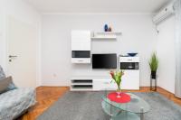Televízia a/alebo spoločenská miestnosť v ubytovaní Apartment KATA
